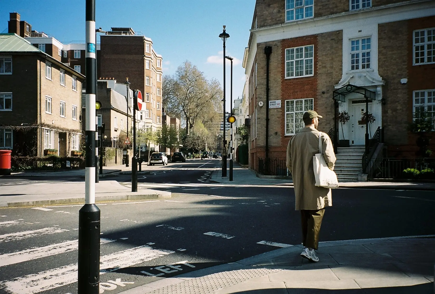 Contact backdrop. An image of Kevin Garcia Martin walking in London.